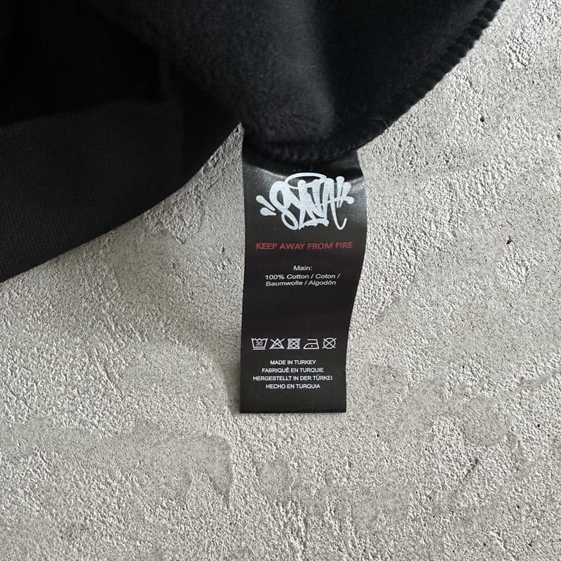 Syna World College Logo Black/Yellow My Store